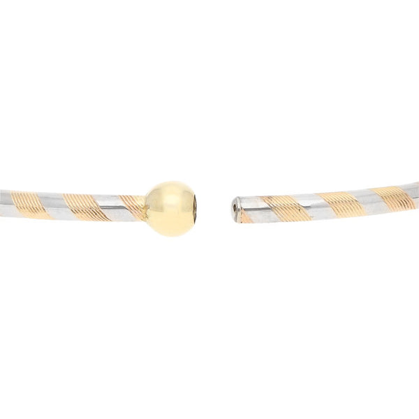 Pulsera de arillo articulada en oro tres tonos 14 kilates.