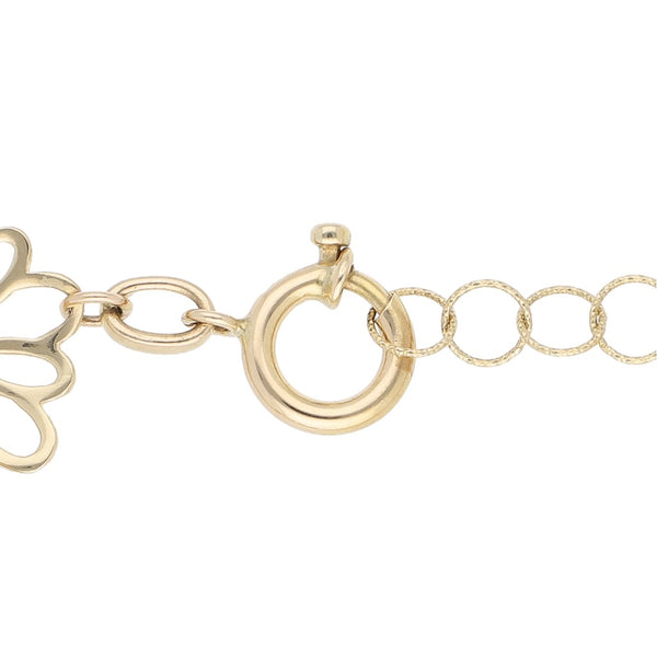 Pulsera eslabón articulado motivo flor en oro dos tonos 14 kilates.