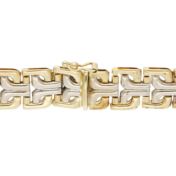Pulsera articulada en oro dos tonos 14 kilates.