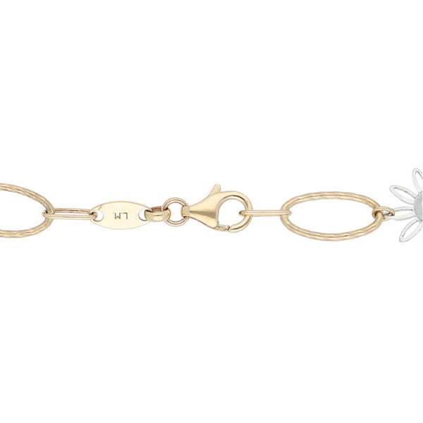 Pulsera eslabón combinado motivo flor en oro dos tonos 14 kilates.
