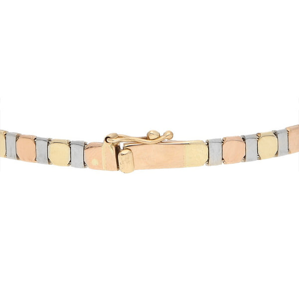 Pulsera eslabón articulado en oro tres tonos 14 kilates.
