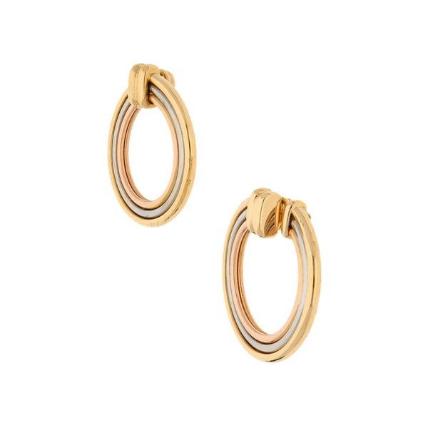 Arracadas lisas firma Cartier en oro tres tonos 18 kilates.