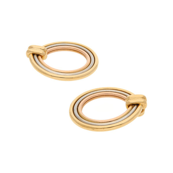 Arracadas lisas firma Cartier en oro tres tonos 18 kilates.