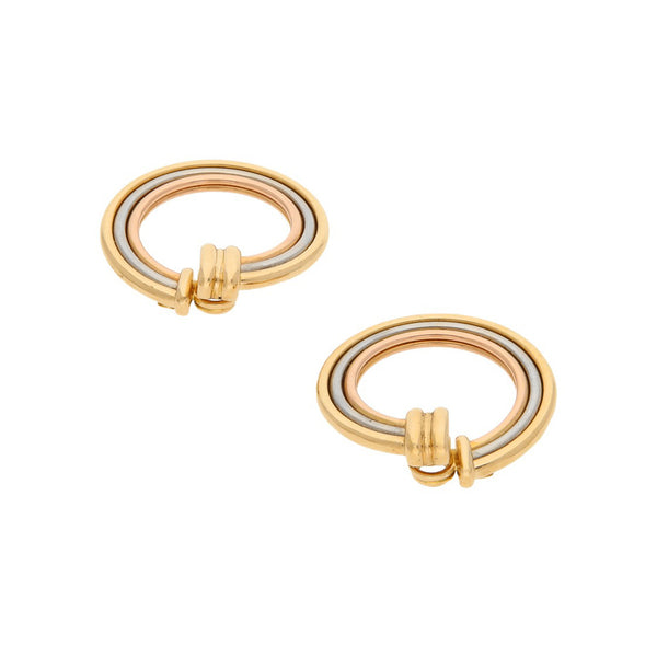 Arracadas lisas firma Cartier en oro tres tonos 18 kilates.