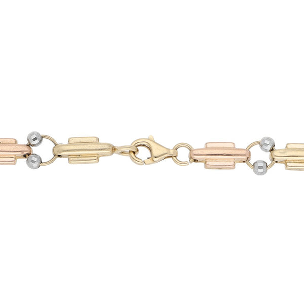 Pulsera eslabón combinado con aplicaciones en oro dos tonos 14 kilates.