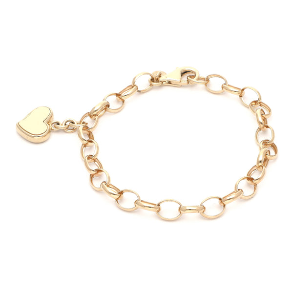 Pulsera eslabón cruzado con colgante motivo corazón en oro amarillo 14 kilates.
