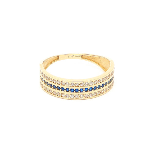Anillo diseño especial con sintéticos en oro amarillo 14 kilates.