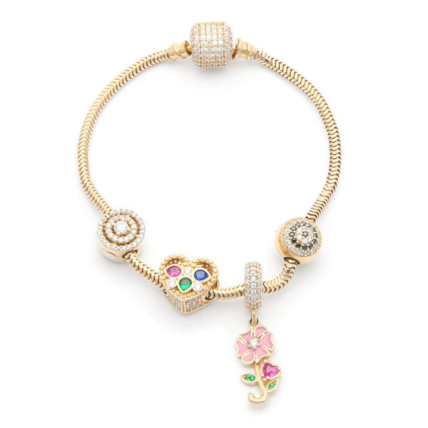 Pulsera eslabón cola de ratón con aplicaciones y colgante motivo flor con sintéticos y esmalte en oro amarillo 14 kilates.
