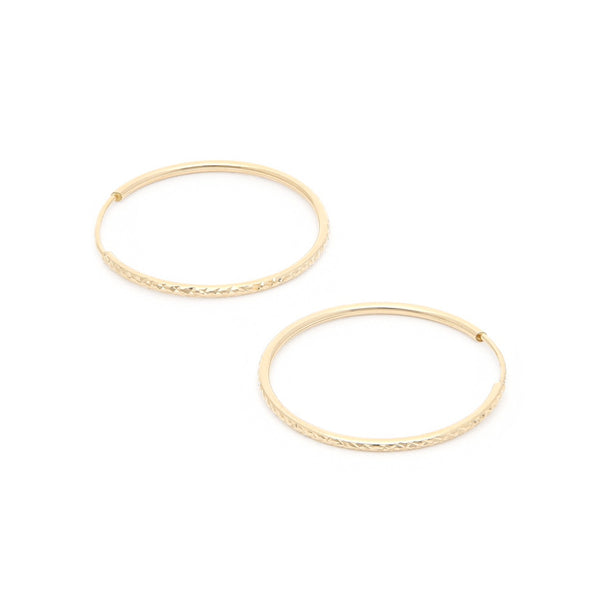 Arracadas facetadas en oro amarillo 14 kilates.
