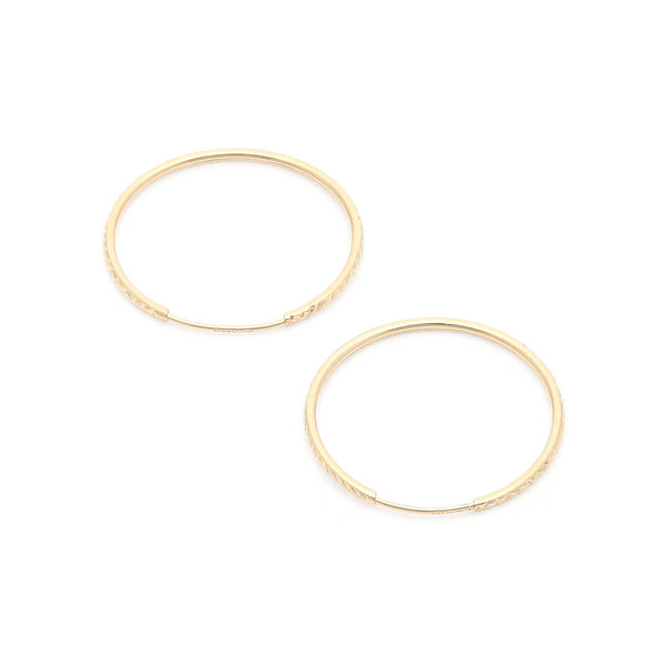 Arracadas facetadas en oro amarillo 14 kilates.