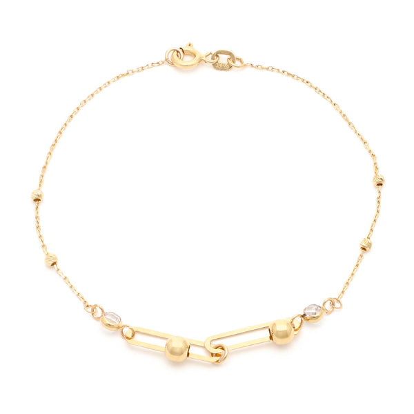 Pulsera eslabón cruzado con aplicaciones de sintéticos en oro amarillo 14 kilates.