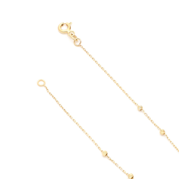 Pulsera eslabón cruzado con aplicaciones de sintéticos en oro amarillo 14 kilates.