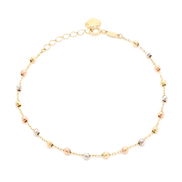 Pulsera eslabón combinado con colgante motivo corazón en oro tres tonos 14 kilates.