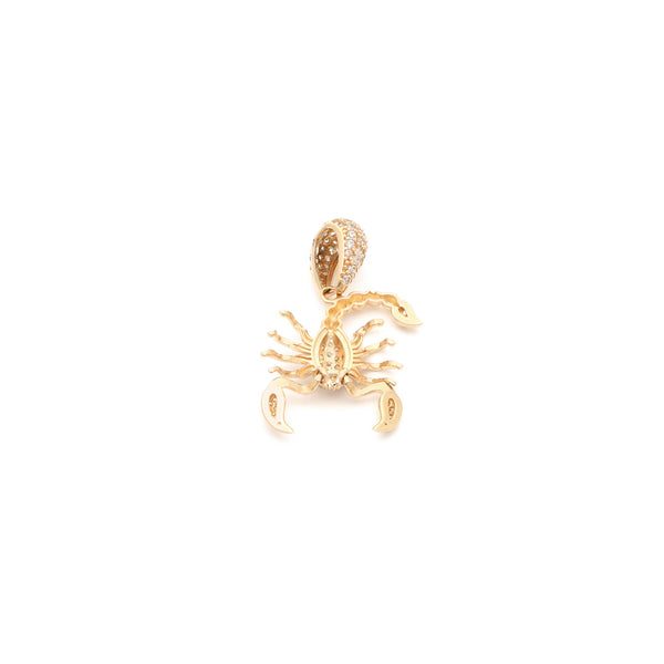 Dije articulado motivo escorpión con circonias en oro amarillo 14 kilates.