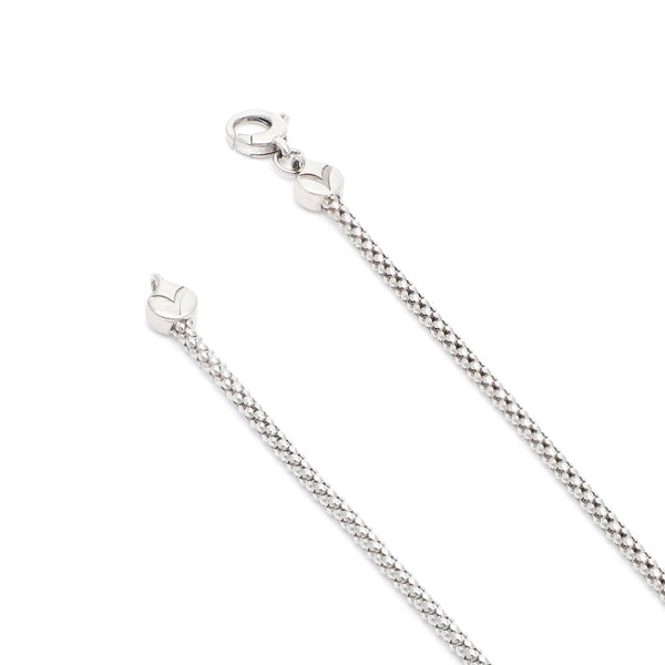 Pulsera eslabón tejido en oro blanco 14 kilates.