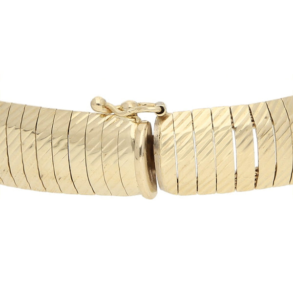 Pulsera eslabón laminado en oro amarillo 14 kilates.