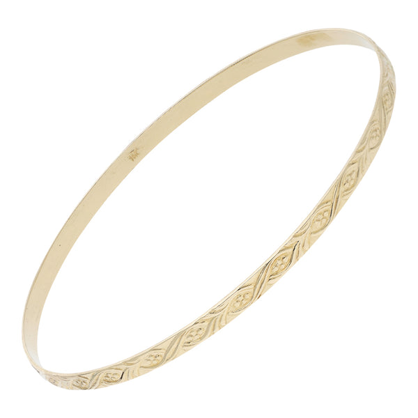 Pulsera de arillo labrada en oro amarillo 14 kilates.