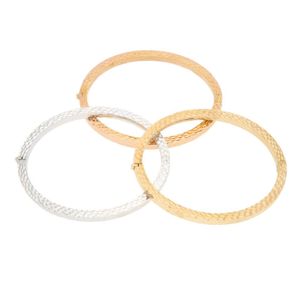 Tres pulseras de arillo articuladas en oro tres tonos 14 kilates.