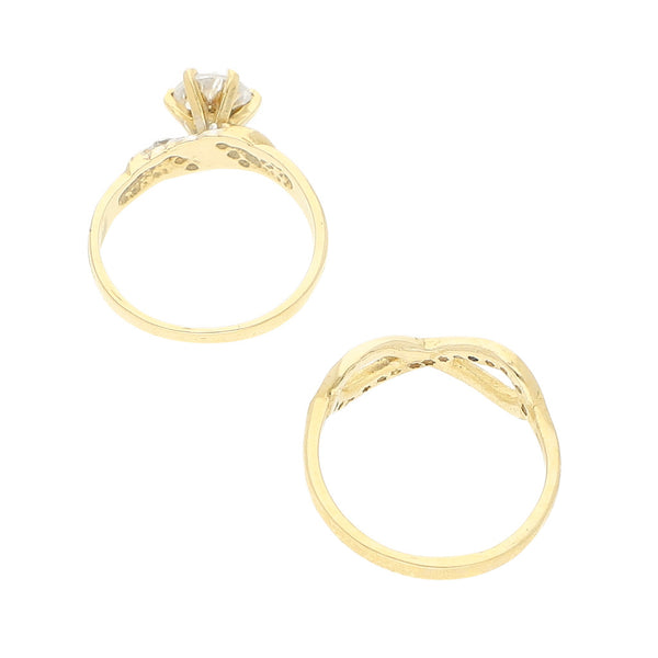 Dos anillos de compromiso y calado con sintéticos en oro amarillo 14 kilates.