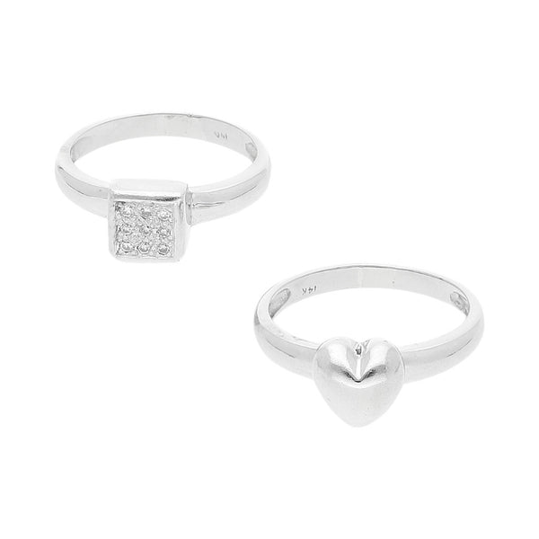 Dos anillos diseño especial motivo corazón y cuadro con diamantes en oro blanco 14 kilates.