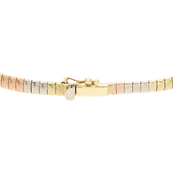 Pulsera eslabón laminado en oro tres tonos 14 kilates.