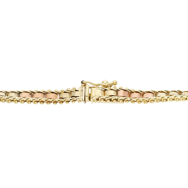 Pulsera eslabón boleado en oro tres tonos 14 kilates.
