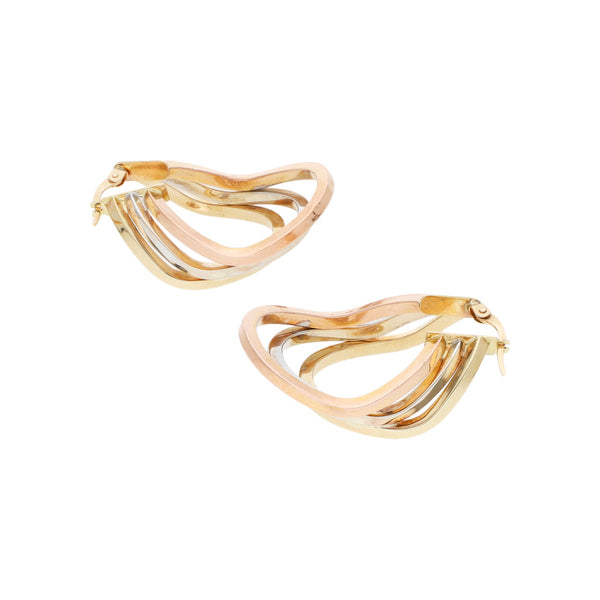 Arracadas diseño especial en oro tres tonos 14 kilates.