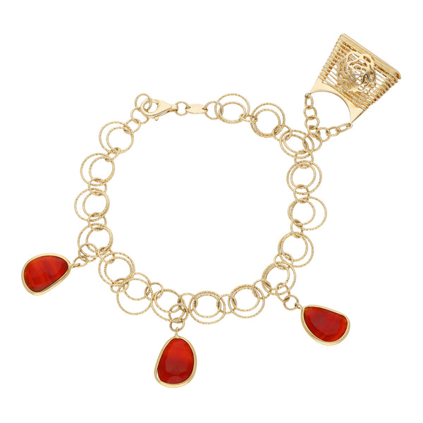 Pulsera eslabón cruzado con colgante motivo bolsa y sintéticos en oro amarillo 14 kilates.