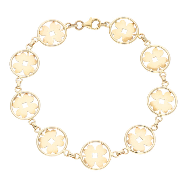 Pulsera eslabón combinado con aplicaciones motivo flor en oro amarillo 14 kilates.