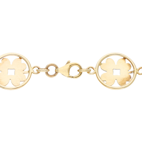 Pulsera eslabón combinado con aplicaciones motivo flor en oro amarillo 14 kilates.