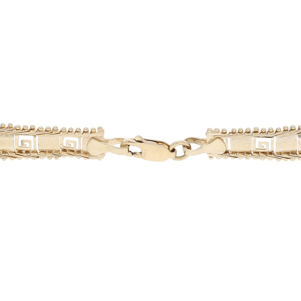 Pulsera eslabón boleado motivo grecas en oro amarillo 14 kilates.