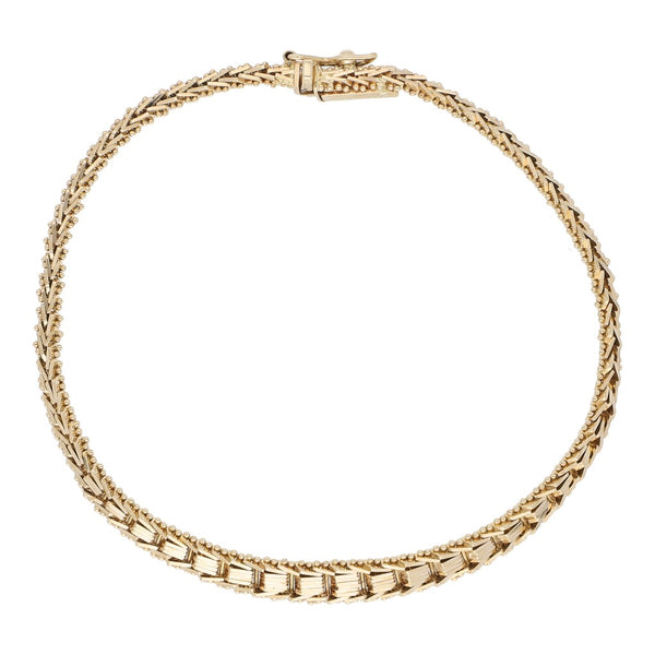 Pulsera eslabón boleado en oro amarillo 14 kilates.