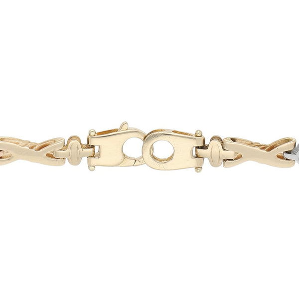 Pulsera eslabón articulado en oro tres tonos 14 kilates.