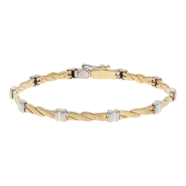 Pulsera eslabón articulado en oro dos tonos 14 kilates.