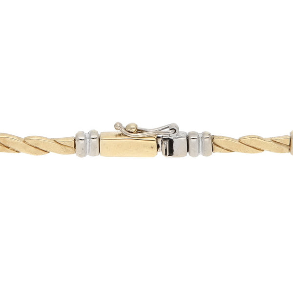 Pulsera eslabón articulado en oro dos tonos 14 kilates.