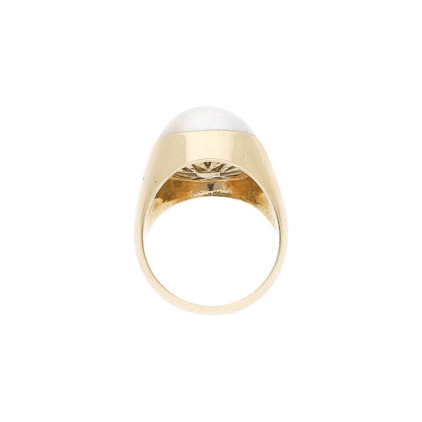 Anillo diseño especial con perla en oro amarillo 14 kilates.