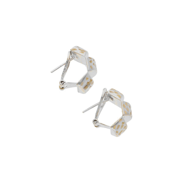 Aretes estilizados en oro blanco 14 kilates.