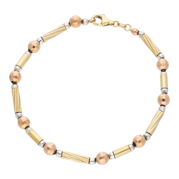 Pulsera eslabón articulado en oro tres tonos 14 kilates.