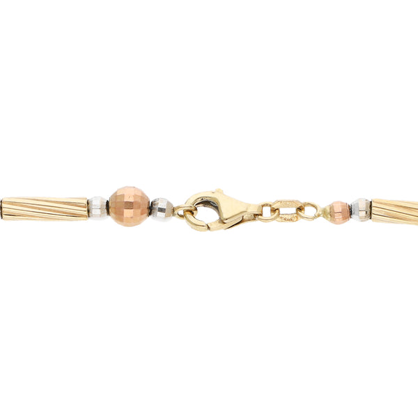 Pulsera eslabón articulado en oro tres tonos 14 kilates.