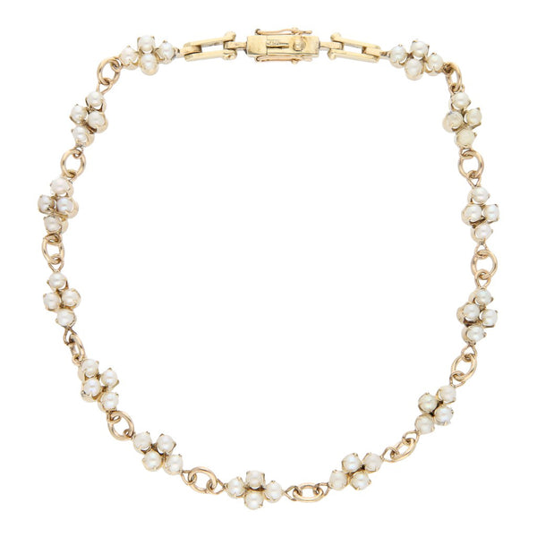 Pulsera eslabón articulado con perlas en oro amarillo 12 kilates.