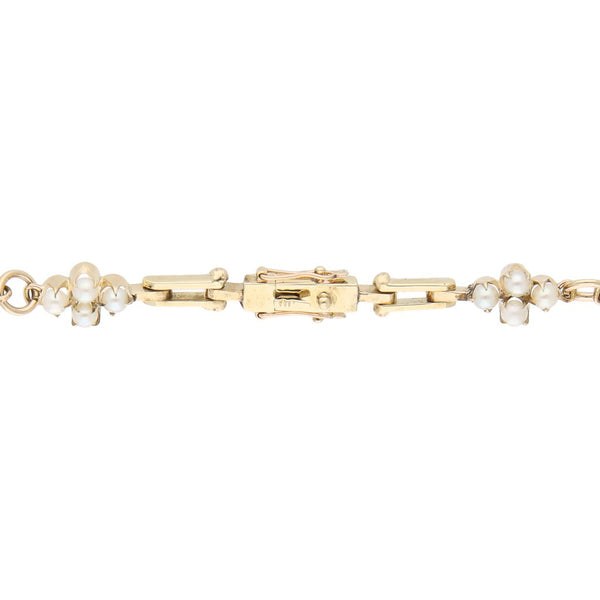Pulsera eslabón articulado con perlas en oro amarillo 12 kilates.