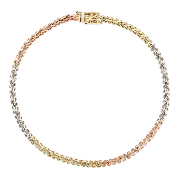 Pulsera eslabón boleada en oro tres tonos 14 kilates.