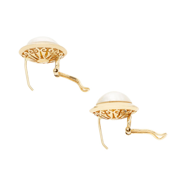 Juego de anillo y aretes diseño especial con media perla en oro amarillo 14 kilates.