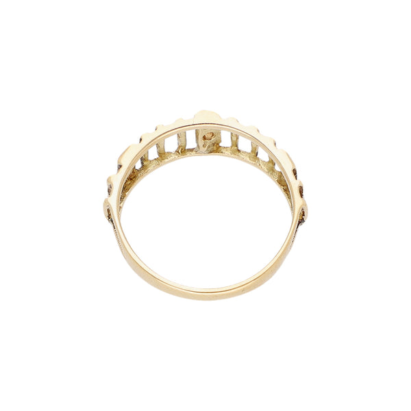 Anillo calado con sintéticos en oro amarillo 14 kilates.