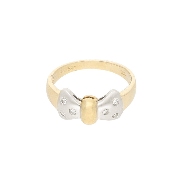 Anillo diseño especial con diamantes motivo moño en oro amarillo 14 kilates.
