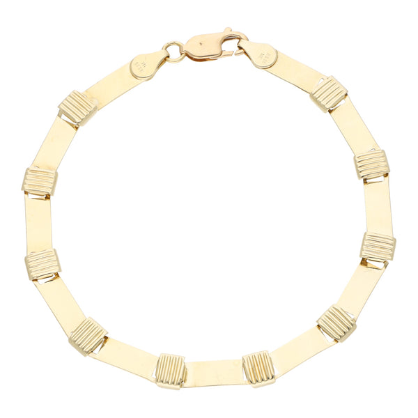 Pulsera eslabón laminado con aplicaciones en oro amarillo 14 kilates.
