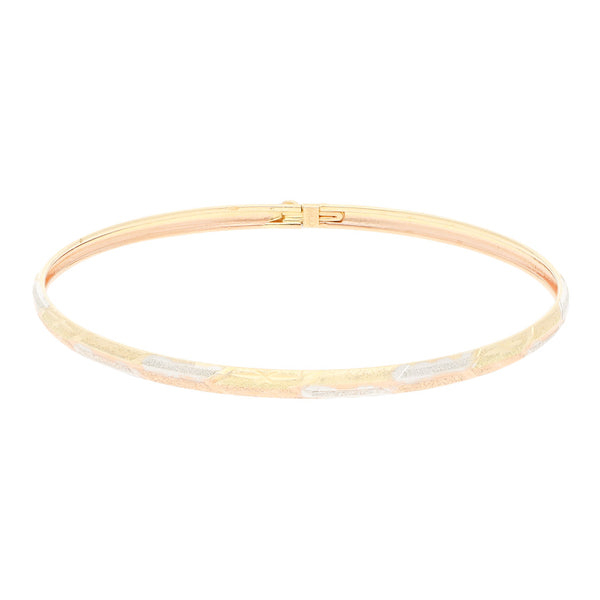 Pulsera de arillo labrado en oro dos tonos 14 kilates.