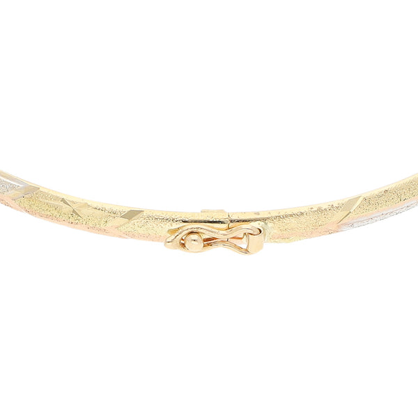 Pulsera de arillo labrado en oro dos tonos 14 kilates.