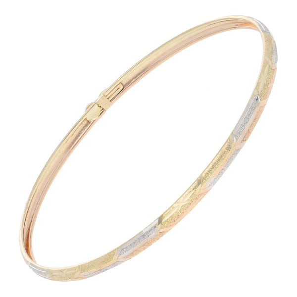 Pulsera de arillo labrada en oro dos tonos 14 kilates.