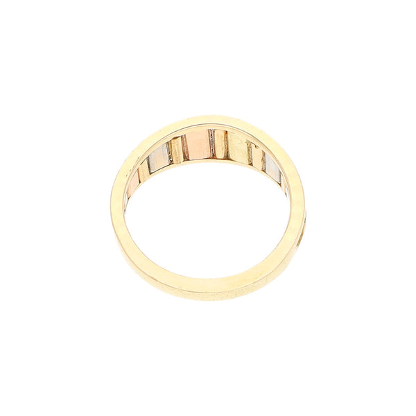 Anillo labrado en oro tres tonos 14 kilates.